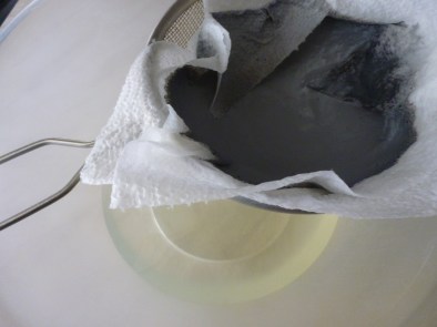 Filtering out the death's head, or caput mortuum.  I put this in the compost.